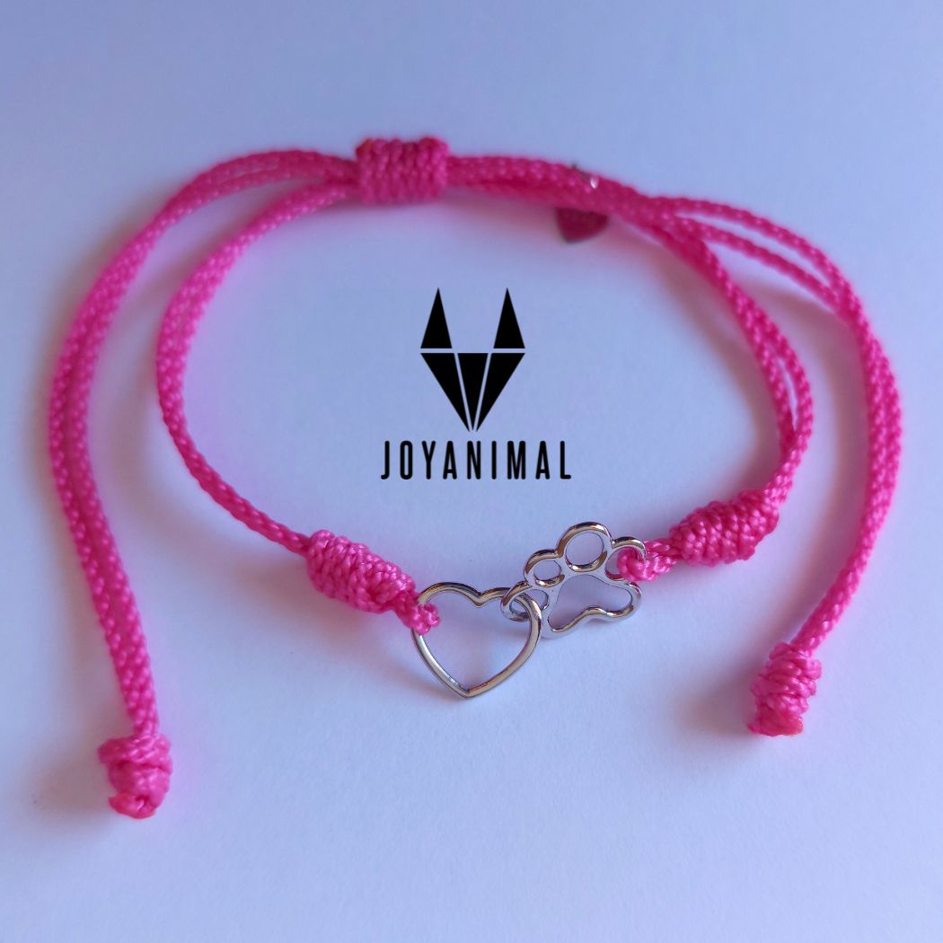 Pulsera tobillera rosa, con corazón y pata de perro o gato sobre fondo blanco con logo de joyanimal