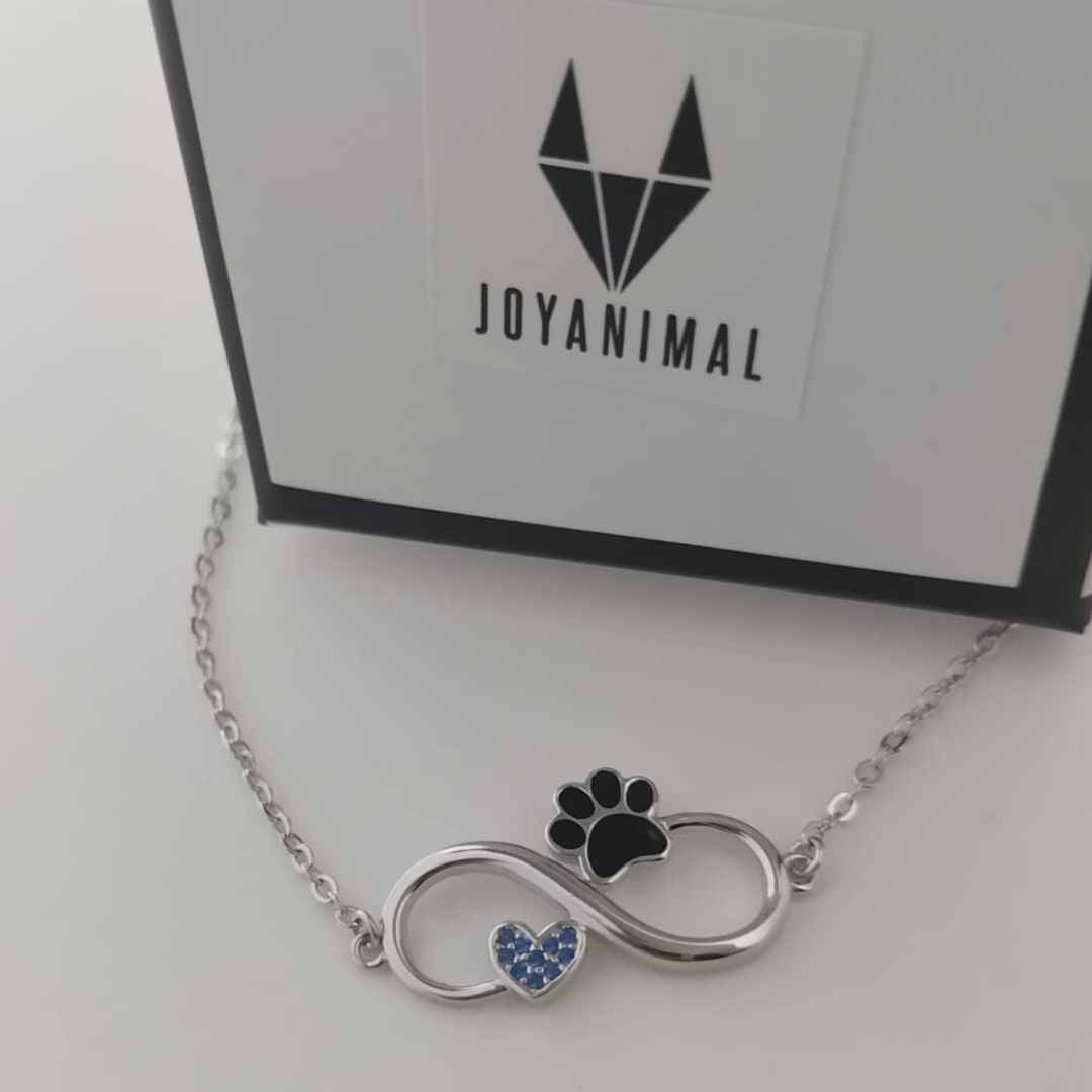 Pulsera del infinito con huella de gato y perro negra y corazón azul de zirconia, con caja de regalo del corte inglésmuestra el amor infinito