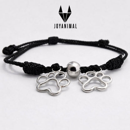Pulsera de hilo ajustable, con dos huellas de perro o gato en plata, para niñas o mujeres TOUS