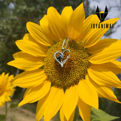 Colgante de love mascotas con corazón con brillantes y huella de plata en un girasol de TOUS