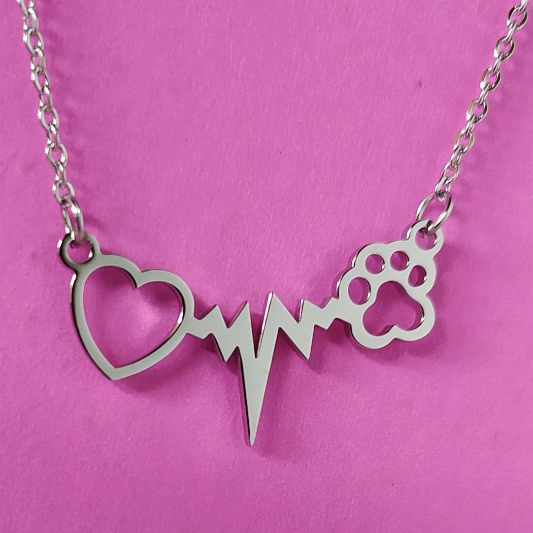 Collar con una línea de vida, una huella de mascota y un corazón, de acero deTOUS