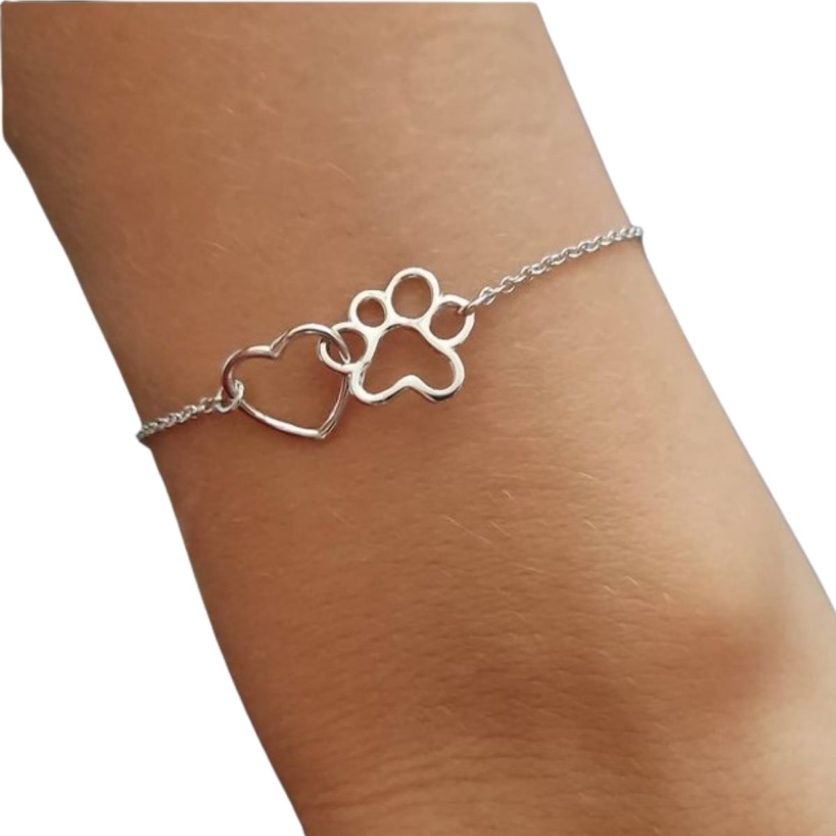 Joya animal - Pulsera huella mascota y corazón en plata de ley, para amantes de los perros y gatos, cadena fina sobre muñeca de mujer modelo.